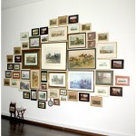 The picture of Fox Hunting in the Bogotá Savannah, 2007. Installation (50 photographs of different sizes, 2 tables, 1 cup of tea and photographic material from where the pictures were found)