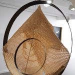 Detail of (vientre) tejido en palma, 2022. Barrel bows, rattan weave, cypress, brass and dyed linen thread, 217 x 138 x 80 cm.